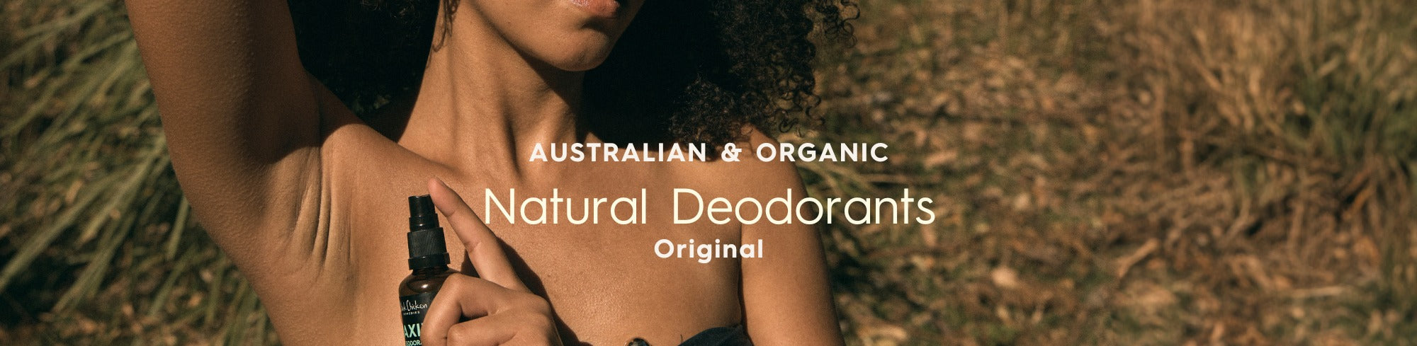 Woman applying Black Chicken natural deodorant spray