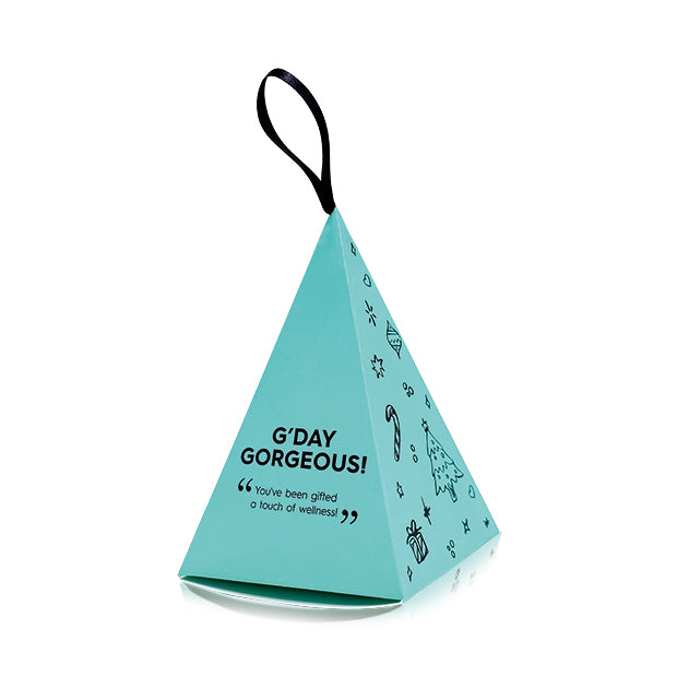 Teal pyramid-shaped gift bag with 'G'DAY GORGEOUS!' text on a white background